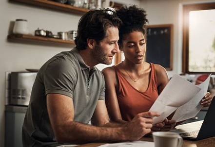 Couple reading paperwork